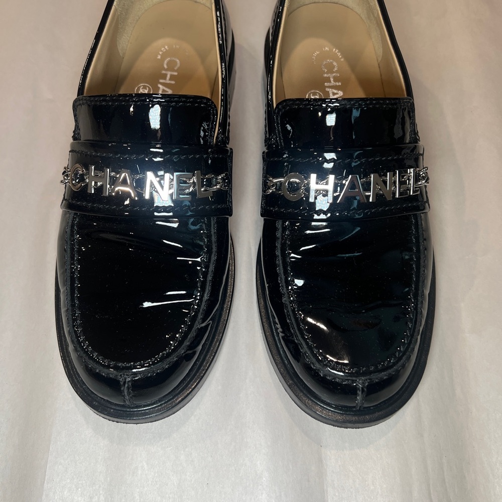 CHANEL Glossy Black Loafers with Silver Accents